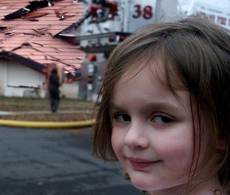 Little sweet girl in front of a damaged house due to a heavy storm