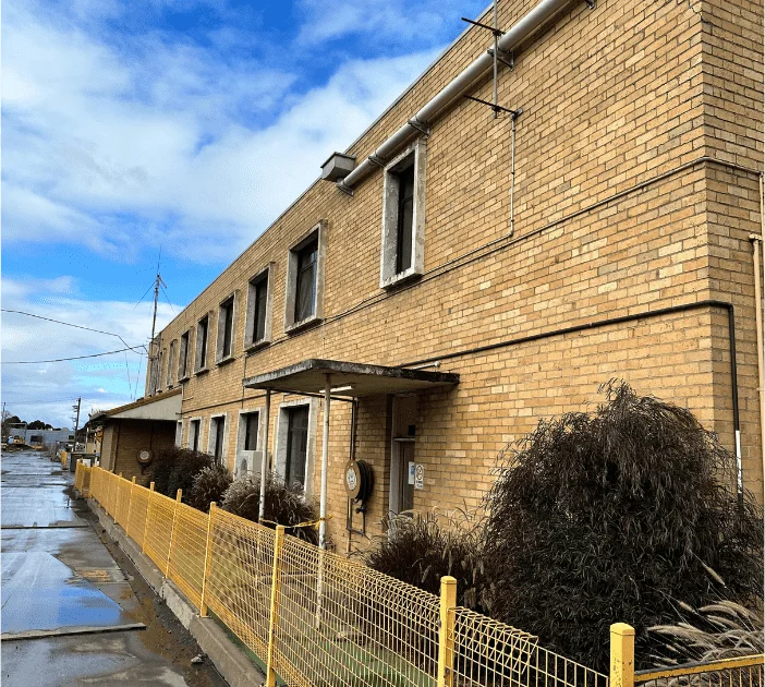 A double storey building in need of roof restoration in middle park
