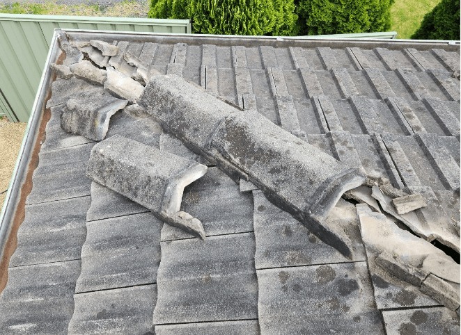 man on roof accessing roof leak