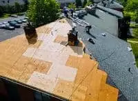 An emergency tarp is placed on the roof to cover it and stopping further water leakage inside the home