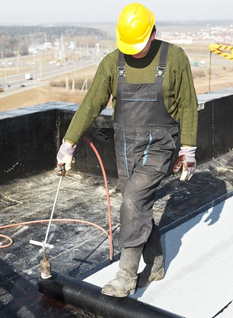 Roofer doing repairs on a roof in hampton