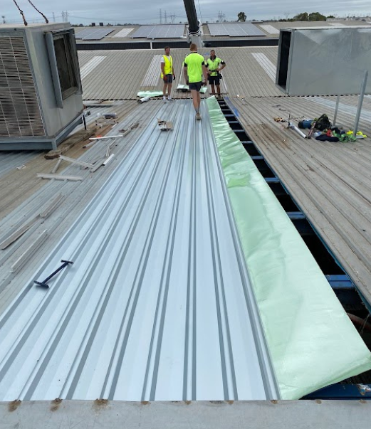 Holymess repairs roofers repairing commercial roof