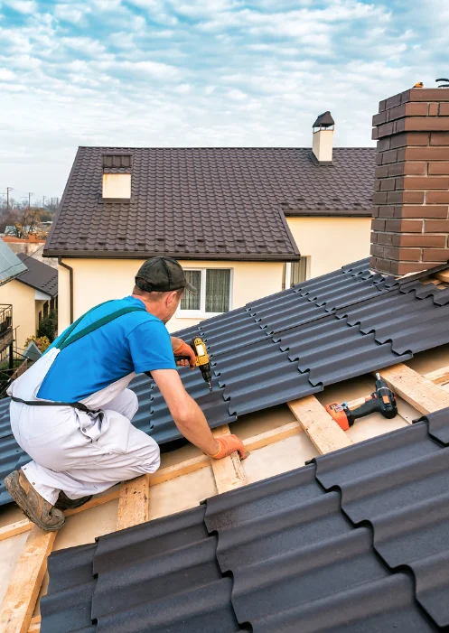 metal roof repairs roofer on roof