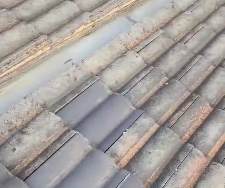 Cracked and slipped concrete roof tiles found during an inspection